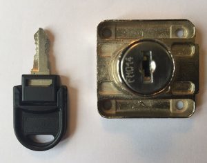 golden color wafer lock with a key on left side