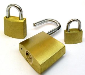 3 golden color padlocks locked and unlocked