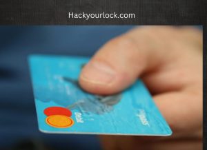 a blue colored credit card in a hand