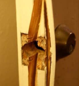 aging and wear and tear of deadbolt lock shown with a broken lock