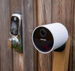 home security with a camera and a deadbolt lock on left
